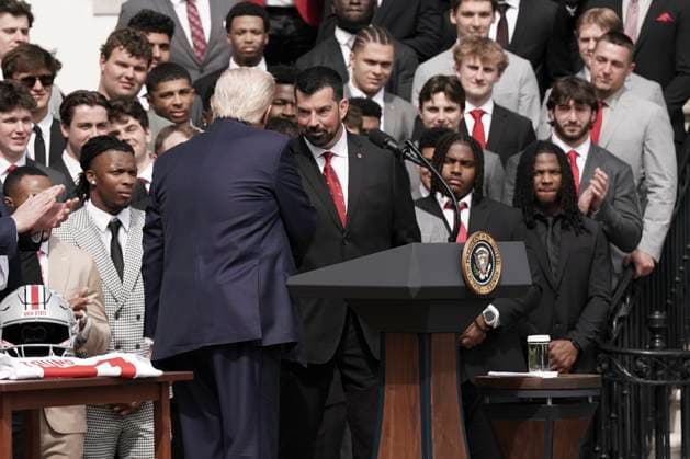U.S. President Trump shakes hands with Ryan Day, coach for the 2025 College Football National Champions - The Ohio State University after he welcomed the 2025 College Football National Champions - The Ohio State University on the South Lawn of the White House in Washington, DC on Monday, April 14, 2025.  WAS20250414562 KenxCedeno