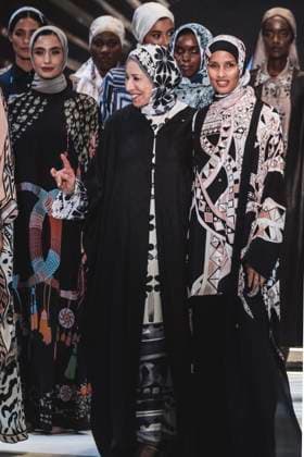 April 15, 2025, Abu Dhabi, United Arab Emirates: Designer Henza Colakoglu (C-L) and Rawdah Mohamed (C-R) Norwegian-Somali model seen while on stage. Turkish brand Imannor presented at the final show of the second day of Abu Dhabi Modest Fashion Week 2025 (14-16 April), organized by Think Fashion at St. Regis Saadiyat Island Resort. Abu Dhabi United Arab Emirates - ZUMAs197 20250415_aaa_s197_619 Copyright: xValeriaxFerrarox