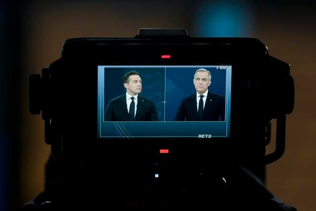 April 17, 2025, Montreal, Quebec, Canada: Conservative Leader Pierre Poilievre, left, and Liberal Leader Mark Carney are seen in a TV camera monitor as they participate in the English-language federal leaders debate, in Montreal, Thursday, April 17, 2025. Montreal Canada - ZUMAc35_ 20250417_zaf_c35_177 Copyright: xAdrianxWyldx