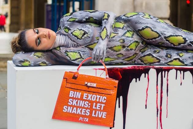 PETA targets exotic skins at London Fashion Week London September 17, 2021 Bodypainted as a snake on a bloody surface, The Only Way Is Essex star Chloe Ross helped PETA cause a stir on the first day of London Fashion Week. Ross held a handbag-shaped sign with the message Bin Snakeskin: Let Snakes Live. The action aims to urge designers and fashionistas to ditch cruelly produced items made from the skins of exotic animals. September 17, 2021 at Somerset House, Strand, London, England, UK. Copyright: xx