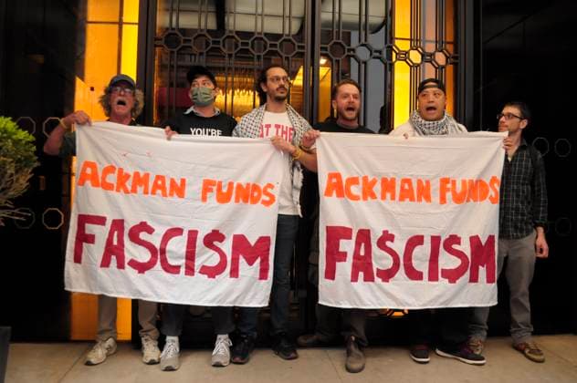 April 22, 2025, New York, United States: Climate activists hold banners and block the entrance of One57, a skyscraper that includes the residence of billionaire hedge fund manager, Bill Ackman. On Earth Day, climate activists in Manhattan, New York City protested against billionaires who fund industries that pollute the planet and demanded affordable housing. Protesters also criticized billionaires supporting Donald Trump. Demonstrators denounced Tesla™s CEO, Elon Musk, for serving as a senior advisor in the Trump administration. The protest began in Columbus Circle. From there, the protesters marched to One57, a skyscraper including the residence of billionaire hedge fund manager, Bill Ackman. Protesters condemned Ackman for endorsing Tr - ZUMAs197 20250422_aaa_s197_307 Copyright: xJiminxKimx