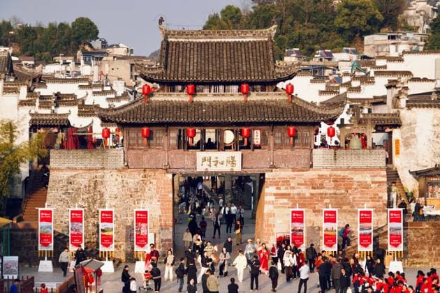 (250423) -- SHEXIAN, April 23, 2025 -- This photo taken on March 18, 2025 shows the Yanghe Gate of Huizhou ancient town in Shexian County, east China s Anhui Province. Bamberg in Germany and Shexian in China show how towns with a remarkable history can thrive today. They answered the 2025 World Heritage Day call to protect heritage under threat from disasters and conflicts, blending conservation with daily life. TO GO WITH Feature: Ancient towns in Germany, China join forces to protect heritage ) LensToLens Ancient towns in Germany, China join forces to protect heritage DuxJuanjuan 