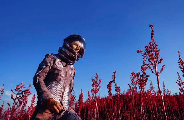 Creative Highlights Symbolfotos Astronaut in a spacesuit exploring a surreal red landscape model released, Symbolfoto, AZF00649