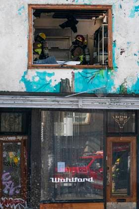 April 23, 2025, Vancouver, Bc, CANADA: Vancouver firefighters look for hot spots while battling a three alarm fire on East Hastings Street in Vancouver, on Wednesday April 23, 2025. Vancouver CANADA  - ZUMAc35_ 20250423_zaf_c35_035 Copyright: xRichxLamx