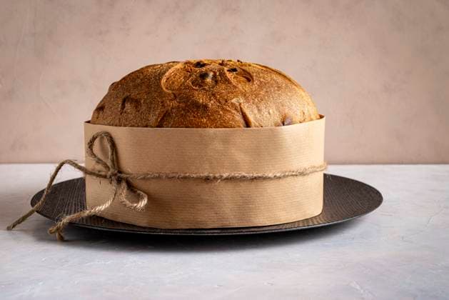 Artisanal panettone, set against a light background, a symbol of Catholic Christmas tradition. Front view.. Artisanal panettone, set against a light background, a symbol of Catholic Christmas tradition. Front view.. Copyright: xMarinaxZanottix MZ111224-1
