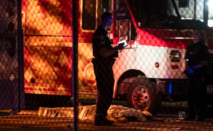 April 26, 2025, Vancouveer, Bc, CANADA: A victim lies near a food truck after a car drove into a crowd at the Lapu Lapu Festival in Vancouver on Saturday April 26, 2025. There has been a number of fatalities and numerous injuries. Vancouveer CANADA  - ZUMAc35_ 20250426_zaf_c35_086 Copyright: xRichxLamx