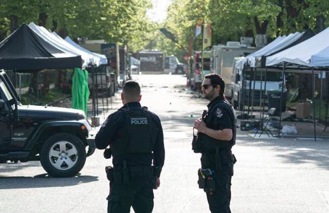 April 27, 2025, Vancouver, Bc, CANADA: Vancouver Police officers secure a street in Vancouver, where a vehicle drove into crowd at a street festival on the night before, on Sunday April 27, 2025. Vancouver CANADA  - ZUMAc35_ 20250427_zaf_c35_017 Copyright: xRichxLamx