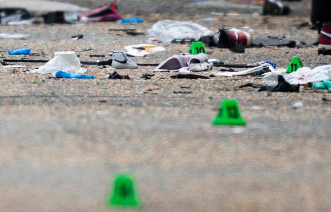 April 27, 2025, Vancouver, Bc, CANADA: Shoes and evidence markers lay on the street while police investigate after a vehicle drove into crowd at a street festival Saturday evening in Vancouver, Sunday, April 27, 2025. Vancouver CANADA  - ZUMAc35_ 20250427_zaf_c35_065 Copyright: xRichxLamx