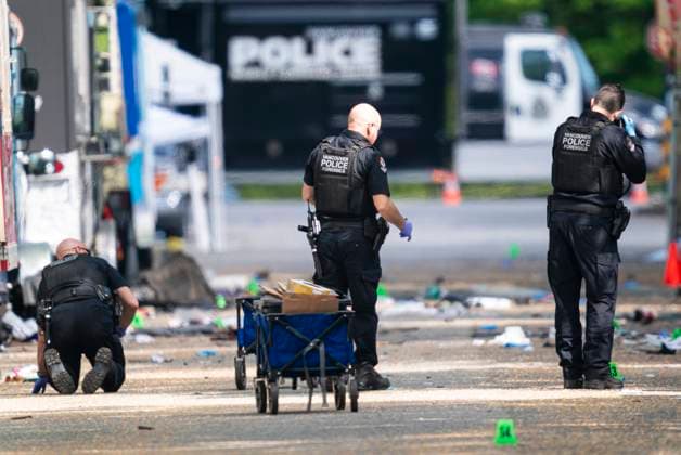 April 27, 2025, Vancouver, Bc, CANADA: Members of the Vancouver Police forensics examine the evidence while investigating the scene where a vehicle drove into crowd at a street festival Saturday evening in Vancouver, Sunday, April 27, 2025. Vancouver CANADA  - ZUMAc35_ 20250427_zaf_c35_071 Copyright: xRichxLamx