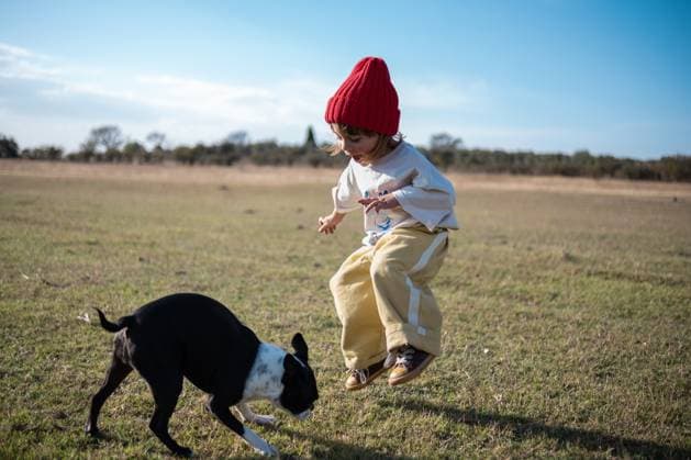 Creative Highlights Symbolfotos Jumping with the Dog on a Crisp Afternoon San Miguel de Allende, Guanajuato, Mexico CR_WDJM250425-1718149-01 ,model released, Symbolfoto