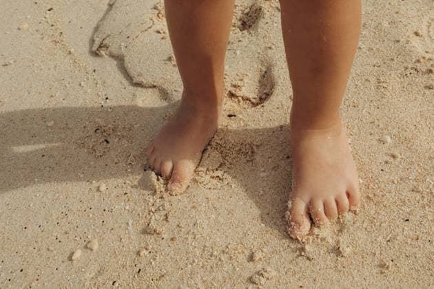 Creative Highlights Symbolfotos Child s bare feet on sandy beach enjoying warm sunshine Balabac, MIMAROPA, Philippines R_ITUP250424-1708103-01 ,model released, Symbolfoto