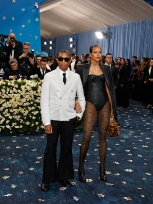 Pharrell Williams and Helen Lasichanh arrive on the red carpet at the 2025 Met Gala celebrating the opening of Superfine: Tailoring Black Style at The Metropolitan Museum of Art on Monday, May 5, 2025 in New York City.  NYP20250505516 JOHNxANGELILLO