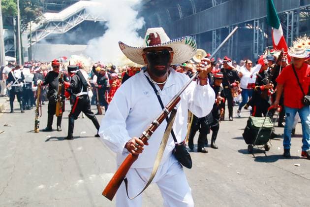 A Inhabitant of the PeoÂ±oÂ³n de los BaoÂ±os neighborhood, taking part during the 95th commemoration of the Battle of Puebla. the Battle of Puebla re-nact in PeoÂ±on de los BaoÂ±os has been declared Intangible Cultural Heritage by the United Nations Educational, Scientific and Cultural Organization (UNESCO). on May 5, 2025 in Mexico City, Mexico. Mexico City Mexico - ZUMAe321 20250505_zia_e321_023 Copyright: xCarlosxSantiagox