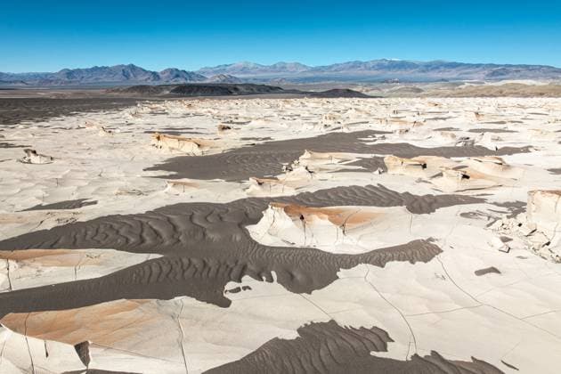 Creative Highlights World Unique pumice fields in Catamarca, Argentina, displaying extensive white and beige volcanic rock formations under a clear blue sky and offering a breathtaking view Model Released JuanLopez_ID28378_836021_013 Copyright: xJuanxLopezx