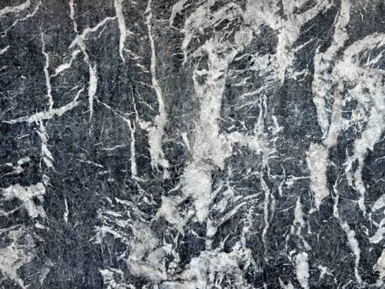 Creative Highlights World Close-up image of a textured stone surface showcasing intricate natural patterns and colors. The blend of gray and white creates an abstract, artistic appearance. Model Released ManuelRuiz_ID28618_844425_008 Copyright: xManuelxRuizx