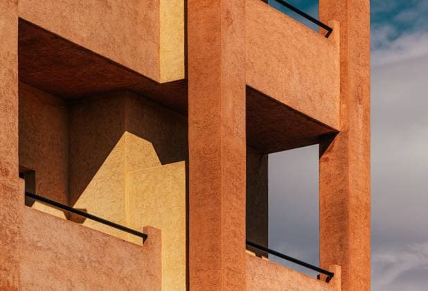 Creative Highlights World Modern architectural facade featuring geometric patterns and warm, textured surfaces. The play of light and shadow adds depth and highlights the building™s distinct lines. Model Released VictorTorres_ID28719_848520_016 Copyright: xVictorxTorresx