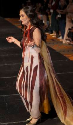 May 11, 2025 - Santa Fe, New Mexico, USA - Former Secretary of the Interior and current candidate for governor of New Mexico, DEB HAALAND, walks the runway in a dress by legendary designer Patricia Michaels during the Second Annual Southwestern Association for Indian Arts (SWAIA) Native Fashion Week. An offshoot of the Santa Fe Indian Market, Fashion Week highlights indigenous design, creativity and representation in the fashion industry. Santa Fe USA - ZUMAce6_ 20250511_zaf_ce6_005 Copyright: xBrianxCahnx