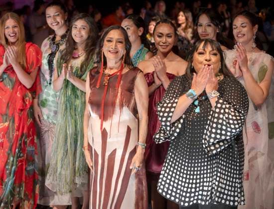 May 11, 2025 - Santa Fe, New Mexico, USA - PM Waterlilly models applaud designer PATRICIA MICHAELS (in black and white) and candidate for governor of New Mexico, DEB HAALAND (center, left) after Haaland had joined them in walking the runway during the Second Annual Southwestern Association for Indian Arts (SWAIA) Native Fashion Week. An offshoot of the Santa Fe Indian Market, Fashion Week highlights indigenous design, creativity and representation in the fashion industry. Santa Fe USA - ZUMAce6_ 20250511_zaf_ce6_009 Copyright: xBrianxCahnx