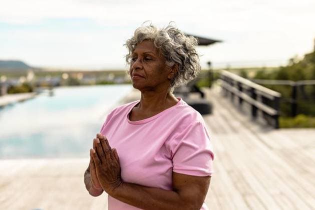 Creative Highlight Symbolbilder Senior woman practicing meditation outdoors at pool deck with hands in prayer, copy space Senior woman practicing meditation outdoors at pool deck with hands in prayer, copy space. Meditation, tranquility, yoga, wellness, outdoor, serenity, nature, mindfulness, model released, , property released, , 15.03.2022, 5851103.jpg, people,meditation,tranquility,yoga,wellness,outdoor,serenity,nature,mindfulness,senior,woman,practice,prayer,hands,deck,pool,green,cloudy,bright,pleasant,atmosphere,peaceful,environment,engaged,moment,aged,relaxation,healthy,selfcare,beauty,calm,focused,spiritual,breathing,harmony,therapy,balance,lifestyle,joy,fitness,leisure,sun,freshness,space,copy space Senior,Elderly,Woman,Female,Mixed-Race