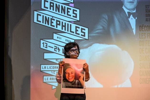 Cannes - Screening Put Your Soul on Your Hand and Walk French Iranian Sepideh Farsi reacts with a photo of killed Palestinian photographer Fatma Hassona, killed in an Israeli attack on her house, at the end of the screening of her movie ‘Put Your Soul on Your Hand and Walk’, as part of ACID competition, at the 78th annual Cannes Film Festival, in Cannes, France, on May 15, 2025. Photo by Ammar Abd Rabbo ABACAPRESS.COM Cannes France  Copyright: xAbdxRabboxAmmar ABACAx