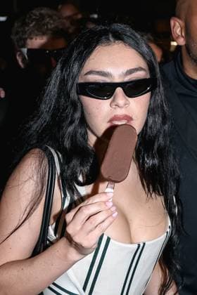May 15, 2025, Cannes, France: English singer, songwriter, and occasional actress CHARLI XCX,32, in her classic micro shorts enjoys some Ice Cream While Walking Down The Croisette On Her Way To Crack Into Pleasure Party Magnum. Cannes France  - ZUMAp169 20250515_zea_p169_1725 Copyright: xAlessandroxBremecx