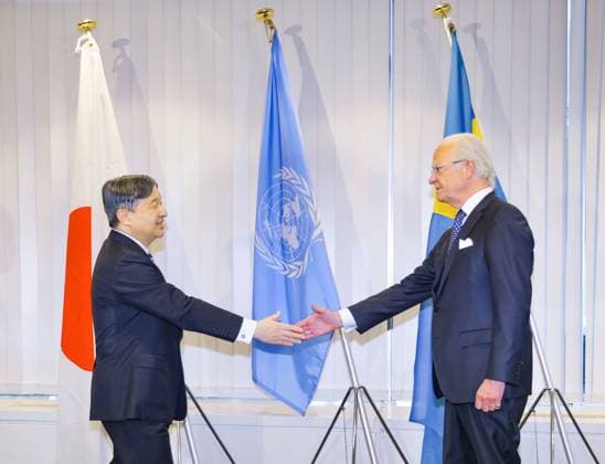 Japanese emperor and Swedish king Carl XVI Gustaf of Sweden (R) greets Japan s Emperor Naruhito on his arrival at United Nations University for an environmental seminar in Tokyo on May 16, 2025. (Pool photo)  A14AA0004554064P
