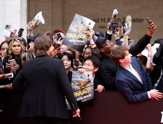 Tom Cruise greets fans when he arrives on the red carpet at the Mission: Impossible The Final Reckoning New York Premiere at Lincoln Center on Sunday, May 18, 2025 in New York City.  NYP20250518107 JOHNxANGELILLO