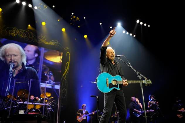 Barry Gibb performing in concert Barry Gibb performing in concert, o2 Arena, Greenwich, London, England, UK, 3rd October 2013. music live on stage concert gig half length playing guitar black shirt microphone singing 3 4 arm raised up CAP MAR Martin Harris Great Britain Copyright: xMartinxHarris CapitalxPicturesx