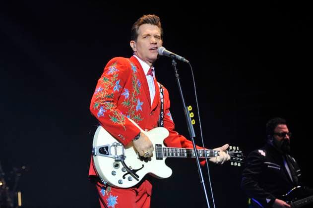 Chris Isaak performing live at the Hammersmith Apollo Chris Isaak performing live at the Hammersmith Apollo, London, England. 9th October 2012 on stage in concert gig performance performing music half length guitar red embroidered suit blue green singing CAP MAR Martin Harris London England Great Britain Copyright: xMartinxHarris CapitalxPicturesx