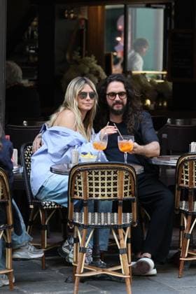 German model Heidi Klum and her husband, musician Tom Kaulitz, shared a romantic kiss and enjoyed a spritz on the terrace of a Parisian cafÃ German model Heidi Klum and her husband, musician Tom Kaulitz, shared a romantic kiss and enjoyed a spritz on the terrace of a Parisian cafÃ  Copyright: xBrendanxYoungx
