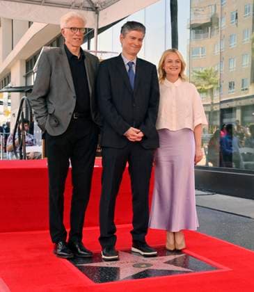 Television writer Michael Schur is joined by actors Ted Danson (L) and Amy Poehler (R) during an unveiling ceremony honoring Schur with the 2,812th star on the Hollywood Walk of Fame in Los Angeles on Wednesday, May 21, 2025.  LAP20205052104 JIMxRUYMEN