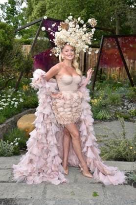 The RHS Chelsea Flower Show on Press Day - 19 May 2025. Tasha Ghouri, wearing a striking floral headpiece in The King s Trust Garden Seeding Success the 2025 RHS Chelsea Flower Show, The Royal Hospital, Chelsea, London, SW3 4SR on VIP & Press Day on Monday 19 May 2025. The headpiece designed by Joe Perkins symbolises how both seeds and young people can overcome adversity and thrive. RHS Chelsea Flower Show 2025 is filled with amazing garden designs and gorgeous floral displays. The RHS Chelsea Flower Show opens on Press Day and runs from 20th - 24th May 2025. Press Day sees florists, designers and celebrities enjoying the many garden designs and floral displays of the world famous horticulture show., Credit:Sue Andrews Avalon The Roy  Copyright: xSuexAndrewsx xAvalonx 1002034675