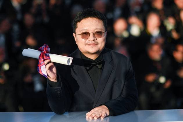 Cannes Winners Photocall AM Bi Gan poses with the Special Prize Award for Resurrection during the Palme D Or Winners photocall in Cannes, France on May 24, 2025 as part of the 78th Cannes Film Festival. Photo by Aurore Marechal ABACAPRESS.COM Cannes France  Copyright: xMarechalxAurore ABACAx