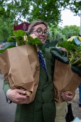 May 24, 2025, London, Westminster, United Kingdom: A man carries two bags out of thew Chelsea Flower Show. Members of the public take the opportunity to purchase flowers and plants that had previously been exhibited in displays at the Chelsea Flower Show. On the final day visitors can seen carrying plants, flowers and garden ornaments out of the venue and through the streets of Chelsea. London United Kingdom - ZUMAs197 20250524_aaa_s197_343 Copyright: xJamesxWilloughbyx