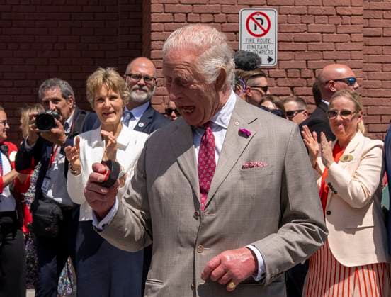 May 26, 2025, Ottawa, On, CANADA: King Charles looks at the puck after participating in a ceremonial puck drop during a visit to Lansdowne Park in Ottawa on Monday, May 26, 2025. Ottawa CANADA  - ZUMAc35_ 20250526_zaf_c35_072 Copyright: xChristinnexMuschix