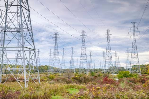 Electricity pylons and overhead power lines in a rural landscape in New York, USA, SMAF03179