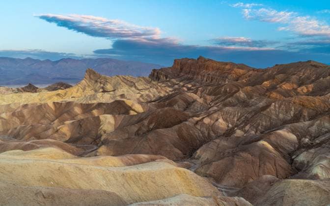 Creative Highlights World Sunrise at Zabriskie Point in Death Valley National Park Death Valley Junction, California, United States CR_CYCY250527-1725453-01