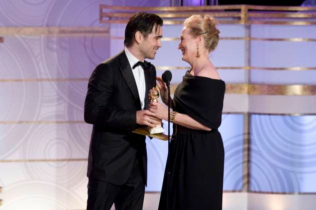 Telecast of the 67th Annual Golden Globe Awards COLIN FARRELL & MERYL STREEP Meryl Streep accepts the Golden Globe Award for BEST PERFORMANCE BY AN ACTRESS IN A MOTION PICTURE Ð COMEDY OR MUSICAL for her role in ÒJulie & JuliaÓ from Colin Farrell at the 67th Annual Golden Globe Awards at the Beverly Hilton in Beverly Hills, CA, USA. January 17th, 2010. globes stage microphone half length black tuxedo off the shoulder dress profile award trophy winner CAP AW HFPA Supplied by Anita Weber Los Angeles California United States Copyright: xSuppliedxbyxAnitaxWeber CapitalxPicturesx