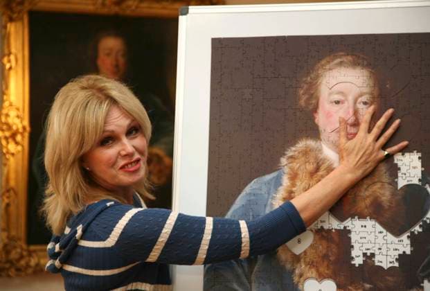 Joanna Lumley at the Olympia International Art & Antiques Fair JOANNA LUMLEY adds the first piece to a jigsaw puzzle of John Rolle Walter by Pompeo Batoni. Pieces of the jigsaw are being sold to visitors at the Olympia International Art & Antiques Fair to raise Â£15,000 towards the purchase of the painting for the Royal Albert Memorial Museum. London, 4th June 2008. half length blue and white striped cardigan red lipstick puzzle pieces CAP DS Dudley Smith London Great Britain Copyright: xDudleyxSmith CapitalxPicturesx