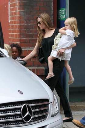 The Jolie-Pitt family seen exiting the Odeon Cinema in Richmond Zahara Jolie-Pitt, Angelina Jolie & Vivienne Jolie-Pitt The Jolie-Pitt family seen exiting the Odeon Cinema in Richmond, London, England, UK, 4th September 2011. full length children kid sunglasses trousers daughter daughters holding blanket side black top carrying twins bag ballet flats mother mum mom CAP HIL John Hillcoat London Great Britain Copyright: xJohnxHillcoat CapitalxPicturesx