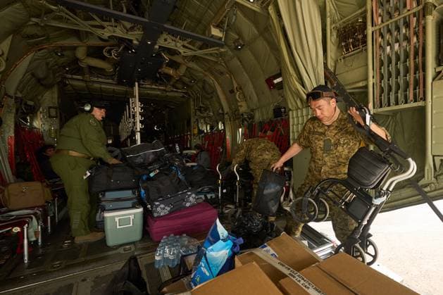 June 3, 2025, Norway House, Mb, CANADA: Royal Canadian Air Force Cpl. Ethan Cai helps load cargo as evacuees from Pinaow Wachi Care Home board a C-130 Hercules aircraft in Norway House, Man., Tuesday, June 3, 2025, at the Norway House Airport as crews continue to fight wildfires in northern Manitoba. Norway House CANADA  - ZUMAc35_ 20250603_zaf_c35_043 Copyright: xDavidxLipnowskix