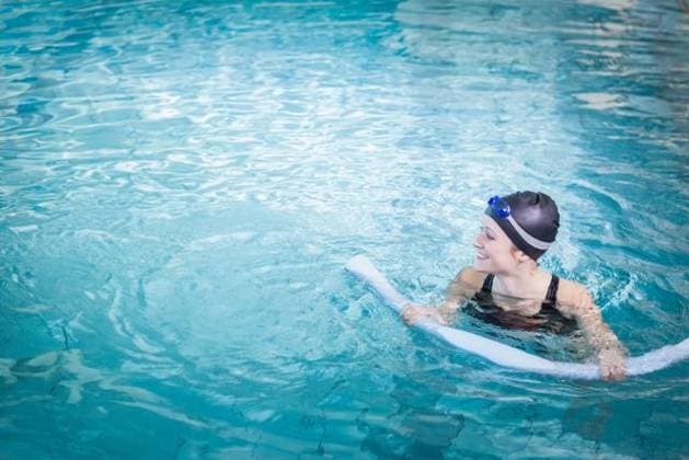 Woman floating with foam noodle in pool wearing black swimsuit, swim cap, blue goggles, copy space Woman floating with foam noodle in pool wearing black swimsuit, swim cap, blue goggles, copy space. Fitness, leisure, aquatic, relaxation, wellness, summer, lifestyle, model released, , property released, , 11.10.2015, 6299594.jpg, people,foam noodle,pool,swimming,woman,black swimsuit,swim cap,blue goggles,white female,floating,fitness,leisure,aquatic,relaxation,wellness,summer,lifestyle,young adult,water,clear,turquoise,ripples,holding,kicking,smiling,one-piece swimsuit,recreation,swimmer,sport,health,exercise,water sport,calm,aquatic exercise,buoyant,bright,sunlight,wellness activity,personal care,casual,water surface,horizontal,copy space,