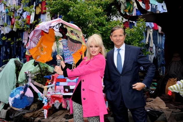 Marks And Spencers Shwopping Launch Joanna Lumley & Marc Bolland Joanna Lumley and Marks and Spencers CEO Marc Bolland launch M&S Shwopping campaign, Brick Lane , London, England. April 26th, 2012 half length black suit clothes clothing hanging blue tie hand arm pink trousers print grey gray umbrella CAP WIZ Wizard Great Britain Copyright: xWizard CapitalxPicturesx
