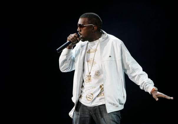KIIS FM 2006 Wango Tango - Irvine KANYE WEST Performs live at The KIIS FM 2006 Wango Tango held at The Verizon Wireless Ampitheatre in Irvine, California, USA. MAY 6TH, 2006 Ref: DVS stage music concert gig performance half length white sunglasses shades singing Supplied By Irvine California United States Copyright: xDebbiexVanxStory CapitalxPicturex