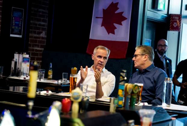 June 14, 2025, Ottawa, On, CAN: Prime Minister of Canada Mark Carney and Prime Minister of the United Kingdom Keir Starmer watch the Edmonton Oilers play the Florida Panthers in the NHL s Stanley Cup Final at a pub in Ottawa, on Saturday, June 14, 2025. Ottawa CAN  - ZUMAc35_ 20250614_zaf_c35_230 Copyright: xJustinxTangx