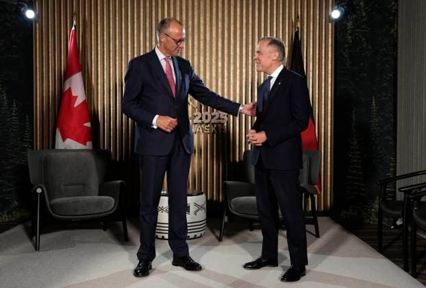 June 15, 2025, Kananaskis, Ab, Canada: Prime Minister Mark Carney meets with German Chancellor Friedrich Merz ahead of the G7 Summit at the Pomeroy Kananaskis Mountain Lodge, approximately 100km west of Calgary, in Kananaskis, Alta., Sunday, June 15, 2025. Kananaskis Canada - ZUMAc35_ 20250615_zaf_c35_225 Copyright: xAdrianxWyldx