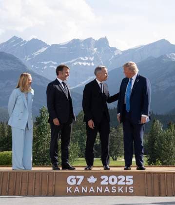 June 16, 2025, Kananaskis, Ab, Canada: Italian Prime Minister Giorgia Meloni, left, and French President Emmanuel Macron look on as Prime Minister Mark Carney speaks to United States President Donald Trump during a group photo at the G7 Summit, in Kananaskis, Alta., Monday, June 16, 2025. Kananaskis Canada - ZUMAc35_ 20250616_zaf_c35_232 Copyright: xAdrianxWyldx