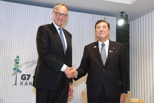 Japan-Germany talks Japanese Prime Minister Shigeru Ishiba (R) and German Chancellor Friedrich Merz shake hands ahead of their talks on June 16, 2025, in Kananaskis, Canada, on the fringes of the Group of Seven summit. (Pool photo)  A14AA0004663410P
