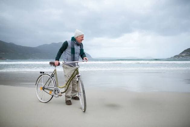 Creative Highlights Symbolbilder Senior man wearing knit beanie and scarf pushing classic bicycle along wet beach near ocean waves Senior man wearing knit beanie and scarf pushing classic bicycle along wet beach near ocean waves. Outdoor, leisure, rustic, scenic, lifestyle, adventure, tranquility, model released, , property released, , 29.09.2016, 6802244.jpg, bicycle,senior,man,beach,pushing,knit beanie,scarf,wet sand,ocean waves,outdoor,leisure,rustic,scenic,lifestyle,adventure,tranquility,coastline,shoreline,coastal,step-through frame,leather saddle,puffer vest,hoodie,cargo pants,hiking shoes,cloudy sky,overcast,cool,rolling hills,distant mountains,solitary,casual,mature,relaxed,nature,solitude,exploration,activity,movement,adult,atmospheric,calm,water edge,environment