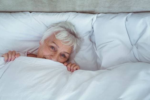 Creative Highlights Symbolbilder Senior woman peeking out from under duvet in bedroom surrounded by white pillows Senior woman peeking out from under duvet in bedroom surrounded by white pillows. Comfort, rest, peaceful, serenity, lifestyle, bedroom, soft, model released, , property released, , 29.11.2015, 6811292.jpg, senior,woman,bedroom,duvet,pillows,comfort,rest,peaceful,serenity,lifestyle,soft,lying,peeking,relaxed,white,hair,nightwear,bed,mattress,bedframe,linens,cozy,calm,tranquility,adult,female,european,private,home,interior,headboard,resting,warmth,peacefulness,single,relaxation,sleep,comforter,bedding,gentle,softness,neat,quiet,cozy atmosphere,light-colored,under,chin,hands,close up,horizontal Senior,Elderly,Woman,Female,Caucasian